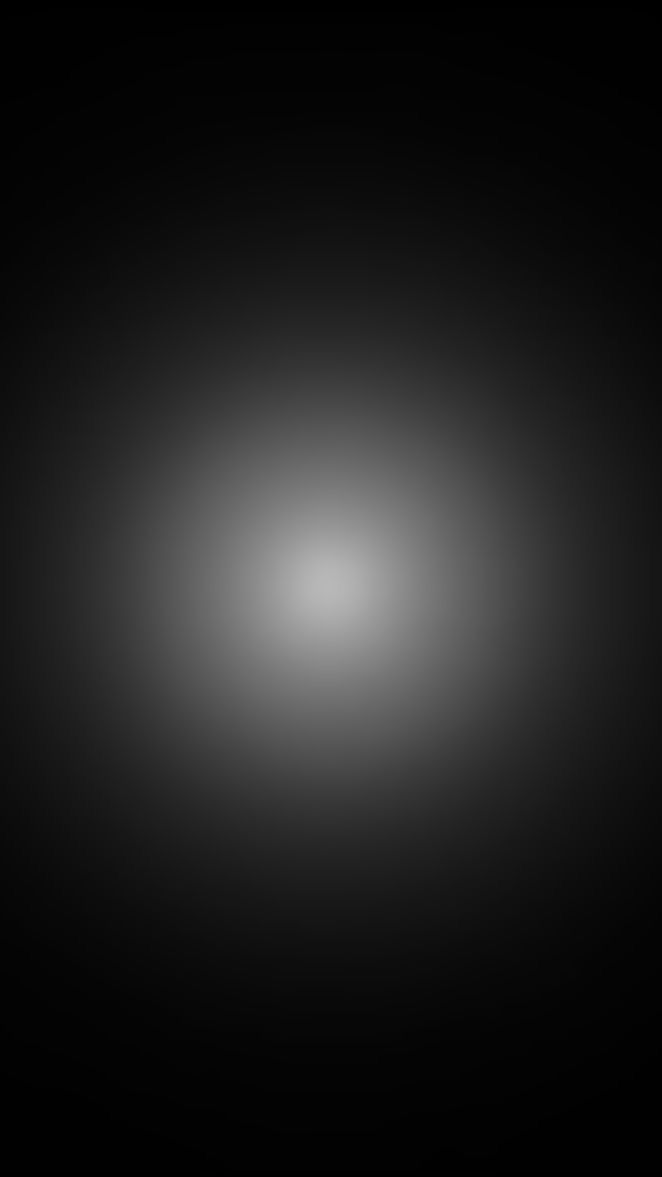 a black and white image of a light in the dark