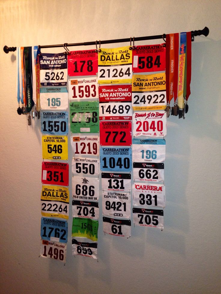 several numbered license plates hanging on a wall