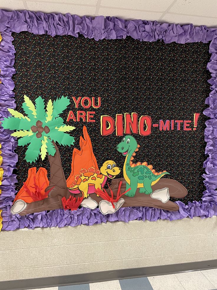 a bulletin board that says you are dino - mite