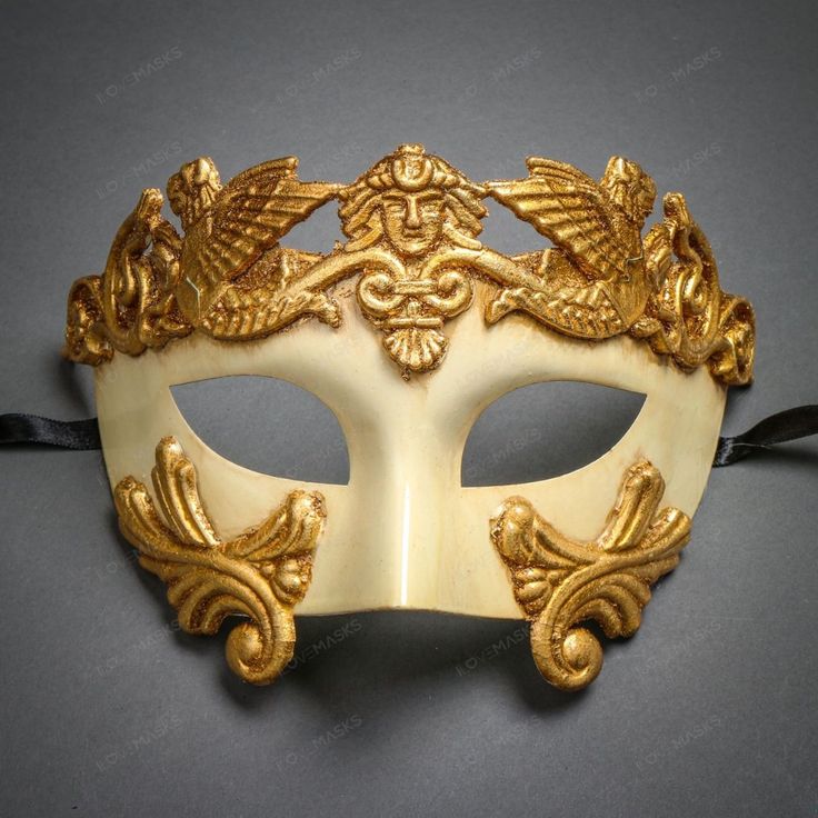 This Greek-Roman Emperor Mask Is Made From Paper Molding And Has An Aged Finish. Decorated With Man And Wing The Mask Is About 6" Tall And 7" Wide. The Masquerade Mask Will Make A Great Costume Accessory. Made From Plastic With Paper Moldings And Hand-Painted. Great For A Masquerade Ball Or Venetian Costume Features Mythological Beasts The Mask Is Approximately 6" Tall And 7" Wide Hand-Painted With An Aged Finish Color: Off-White Gold Usm-M31002-Wtgo Mythological Beasts, Cracked Texture, Venetian Costume, Gold Masquerade Mask, Venetian Masquerade Masks, Grecian Goddess, Venetian Masquerade, Venetian Masks, Antique Bottle