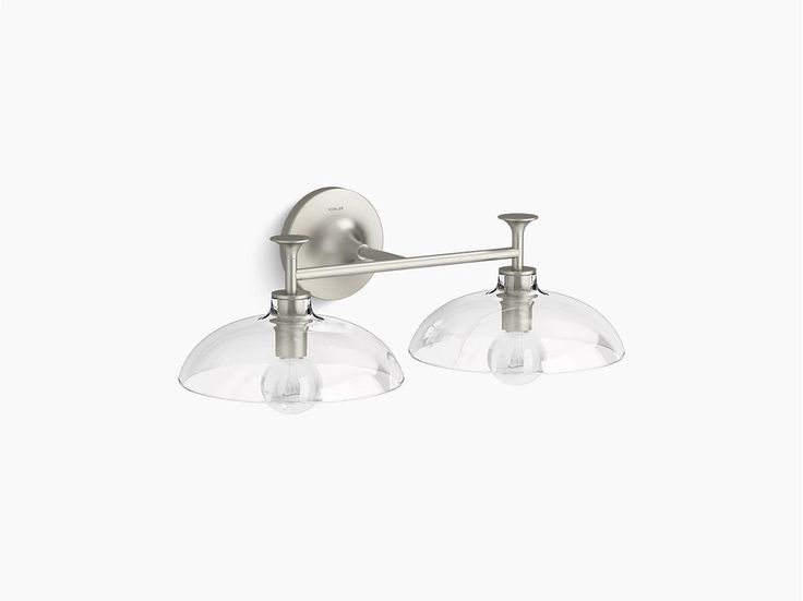 two light bathroom fixture with clear glass shades on the top and bottom half of it