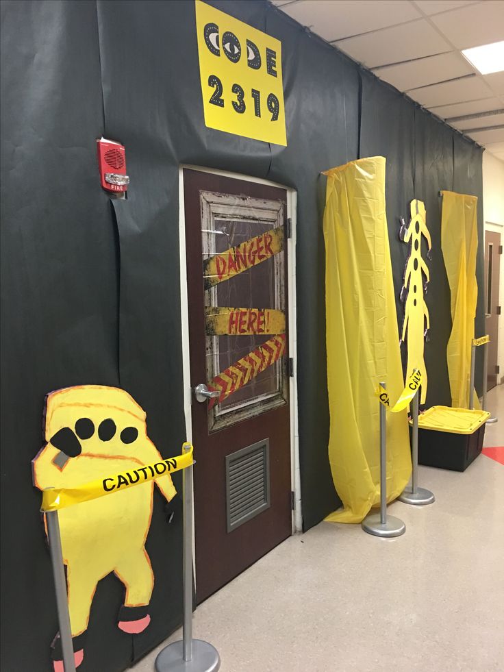 some yellow caution signs are in front of a door