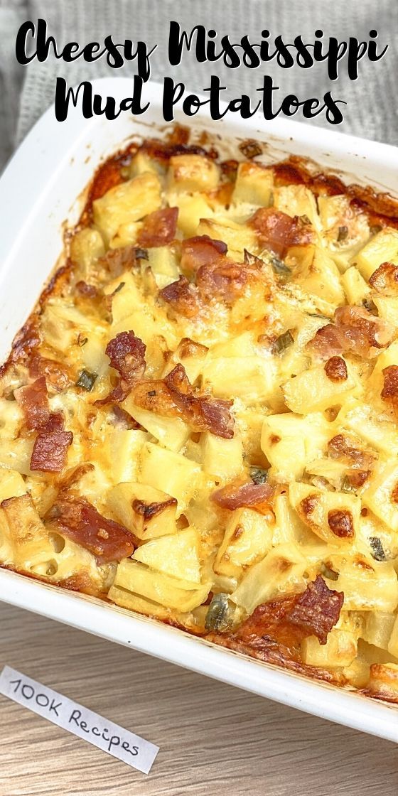 a casserole dish with cheese and ham in it on a wooden table top