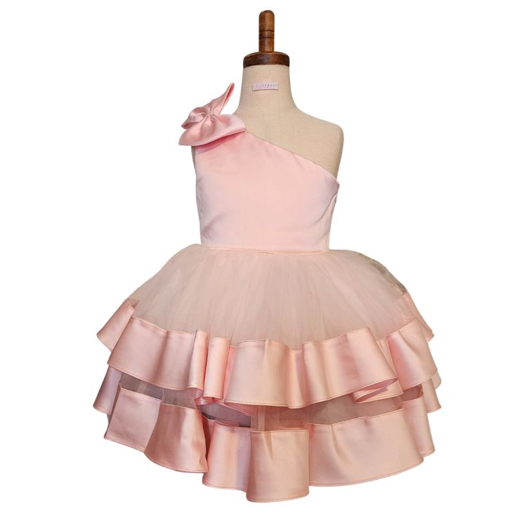 This dress can be worn for any special occasion like weddings, pageants, birthday parties, holiday parties (Christmas or New Years), Father/Daughter Dances, kid's proms, etc Features: Bowknot On One Shoulder Multi-layer Ruffles Satin and Tulle V Back Knee Length Use a crinoline to make the dress stand out Care: Light Iron or Steam to knock out wrinkles; Dry Clean or Spot Clean Pair with our champagne kitten heels to make this dress all the more festive! Holiday Princess Tutu Dress For Dress-up, Fitted Sleeveless Tulle Holiday Dress, Holiday Pink Sleeveless Princess Dress, Fitted Princess Style Tulle Holiday Dress, Pink Sleeveless Holiday Dress For Wedding, Spring Ball Gown Tutu Dress For Dress-up, Spring Sleeveless Pageant Dress For Dress-up, Holiday Pink Tulle Dress, Spring Sleeveless Pageant Dress