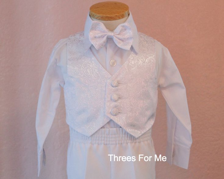 Boy Baptism, Christening Tuxedo Package Our Baptism, Christening White Tuxedo are Perfect for All Amazing Baby Boys. Our tuxes all include 5 pieces -Square style jacket (suit jacket )Jacket has design collar Beautiful image of Virgin Mary embroidered on back and front of suit. -Long Sleeve button down shirt - Vest with matching design from jacket -Adjustable Bow tie with Matching design -Elastic waist pants with design on side of pants Tuxedo Package includes; -Candle set: candle, prayer book, r Tuxedo White, White Tux, Boy Baptism Outfit, Baptism Outfit, Boy Christening, White Tuxedo, Baby Boy Clothing Sets, White Suit, Baptism Dress