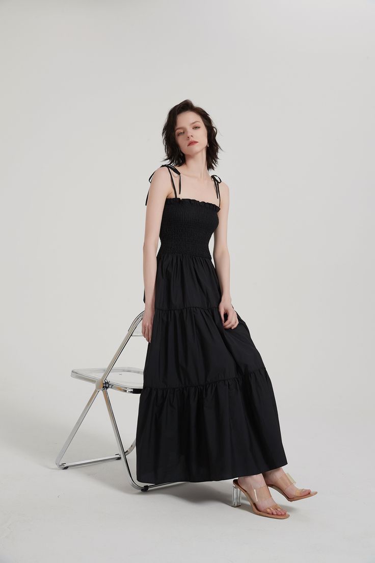 This timeless Tiered Ruffle Slip Maxi Dress will become a wardrobe staple. Crafted from a lightweight blend of 55% Cotton and 45% Modal, it features a spaghetti shoulder strap, straight neck, smocking bodice, eye-catching 3D piping detail along the tiered seam, two side pockets, and an unlined finish. Perfect for summer evenings. Spaghetti shoulder strap Straight neck Smocking bodice 3D piping detail along the tiered seam Two side pockets Unlined (in) S M L Length (Excluding Suspenders) 44.1 44. Chic Maxi Dress With Adjustable Straps And Square Neck, Chic Sleeveless Smocked Dress With Adjustable Straps, Chic Smocked Midi-length Dress With Tie Straps, Chic Smocked Midi Dress With Tie Straps, Chic Smocked Dress With Tie Straps For Spring, Chic Smocked Dress With Spaghetti Straps For Daywear, Chic Midi Length Smocked Dress With Tie Straps, Chic Midi Dress With Smocked Bodice And Straight Neckline, Chic Maxi Dress With Smocked Back And Straight Neckline