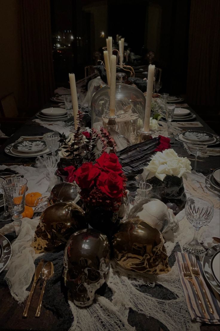 the table is set with silverware and candles