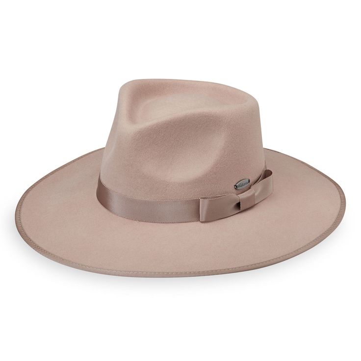 The traditional fedora silhouette gets a modern update with trendy boho-chic styling. The soft felt finish makes it perfect for year-round wear. UPF 50+ fabric blocks 97.5% of ultraviolet rays, according to the Australian Radiation Protection Agency 3¾" brim Packing not recommended Crown size: M (58cm) Wind-resistant adjustable sizing 100% soft brushed wool felt exclusive of trim Spot clean only Wallaroo hats do not feature a built-in magnet for emblems. For hats with magnetic emblems, please pu Wallaroo Hats, Womens Wide Brim Hats, Fabric Blocks, Womens Fedora, Mens Sun Hats, Radiation Protection, Felt Fedora, Hat For Men, Crown Design