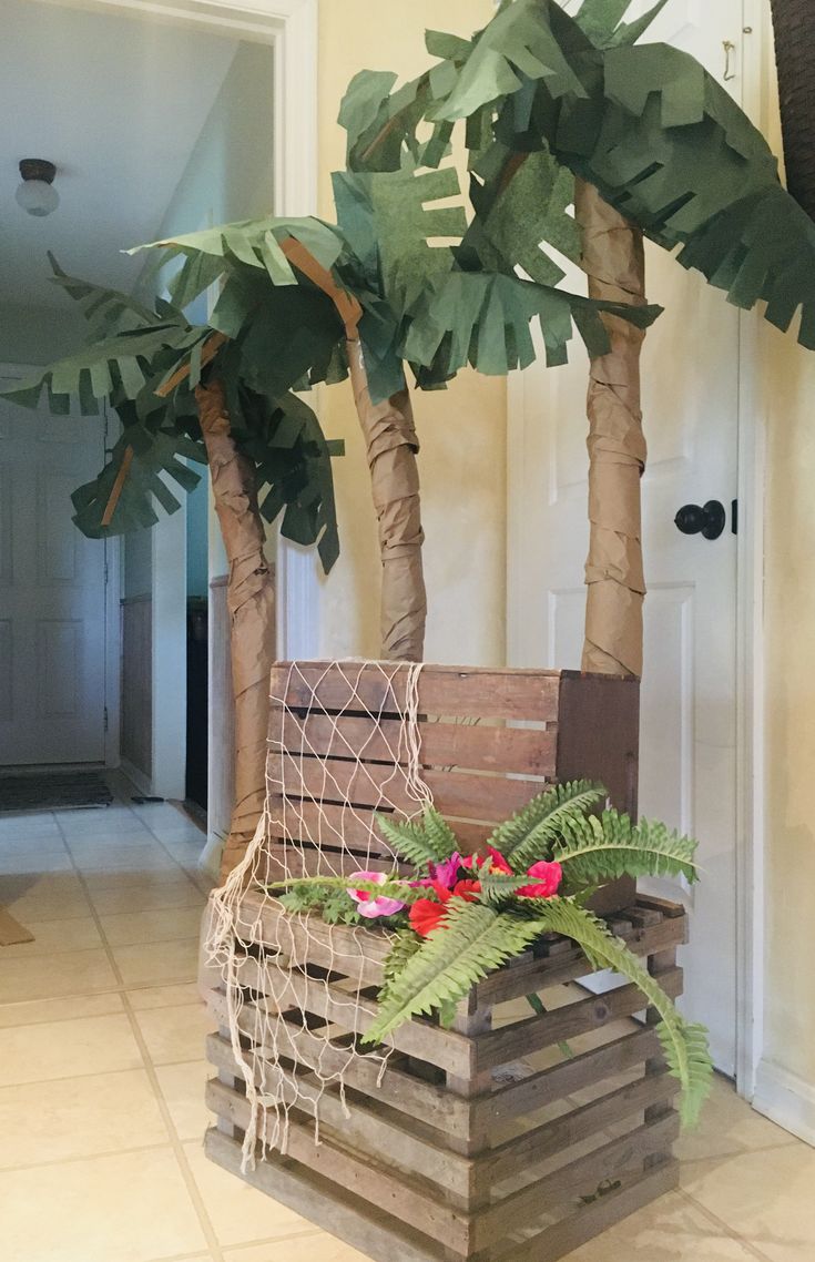 a planter made out of wooden pallets and palm trees