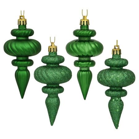 four green glass christmas ornaments on white background