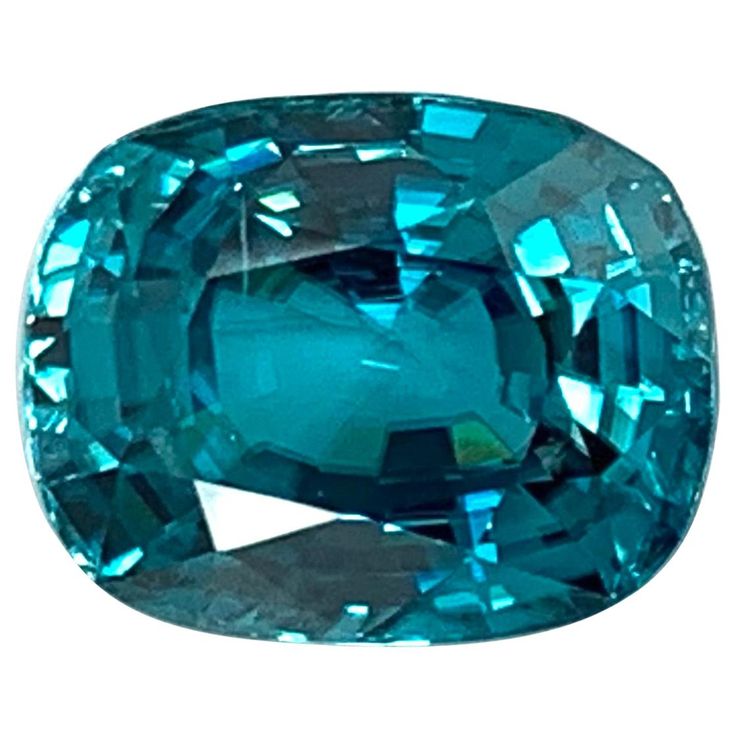 This brilliant, cushion cut gem checks all the boxes if you're looking for an unusually large, fine blue zircon to set in a ring or pendant enhancer! With intense "Windex" blue color and a beautifully proportioned shape, this beautiful zircon is simply stunning. It measures 15.53 x 12.33 x 8.87 millimeters and weighs 19.34 carats. It is an extremely lively stone, highly saturated blue color with a hint of a characteristic secondary greenish tint. A vibrant gem for a spectacular piece of jewelry! Saturated Blue, Zircon Gemstone, Faceted Gems, Zircon Jewelry, Rare Gems, Exclusive Jewelry, Rocks And Gems, Glass Perfume Bottle, Blue Zircon