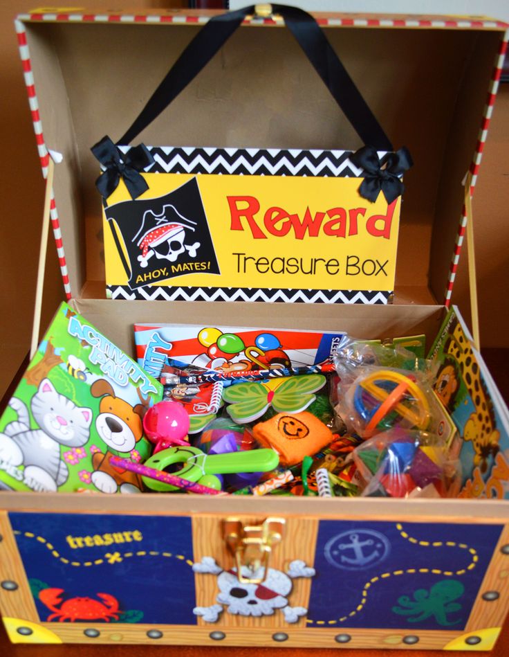 an open box filled with toys on top of a table