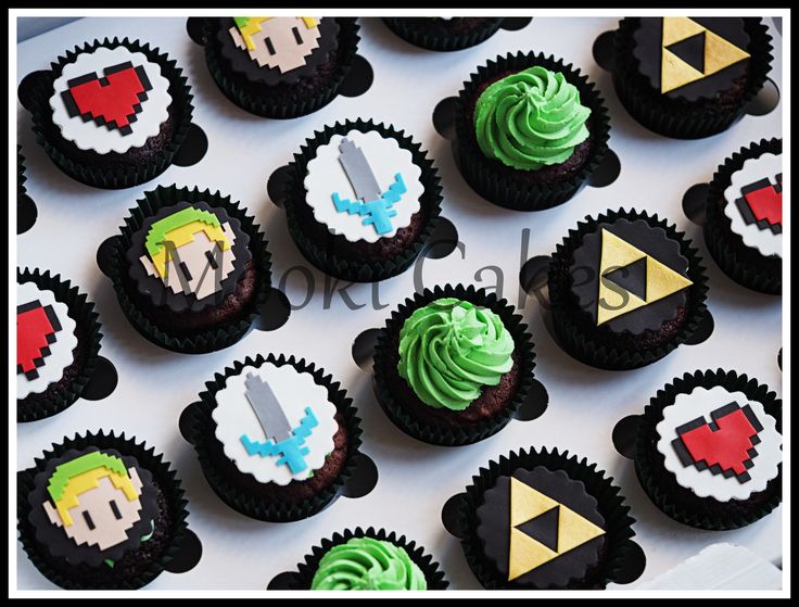 some cupcakes are decorated with video game characters