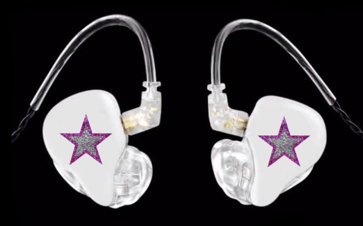 two white ear buds with pink and silver stars on the sides, one is plugged in