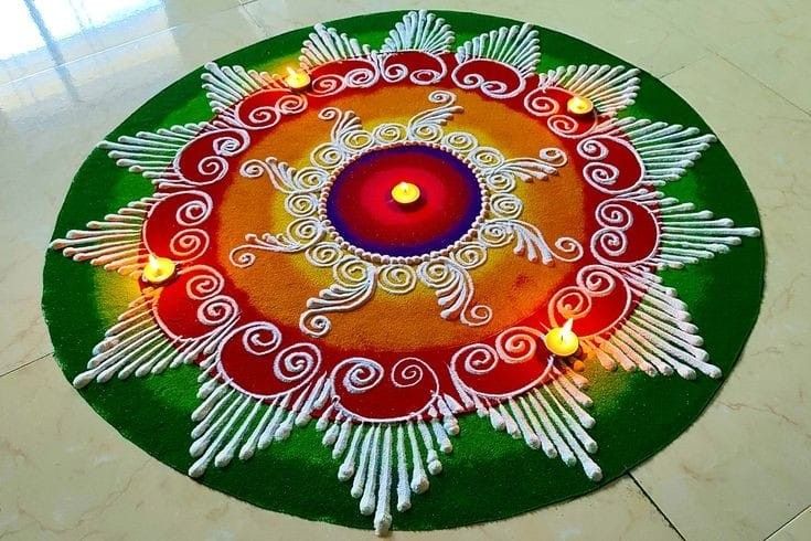 a colorful rangdi with lit candles in the center