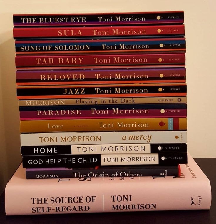 a stack of books sitting on top of a table