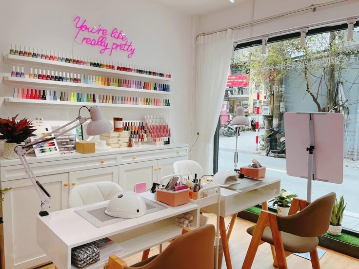 a salon with lots of nail polish on the walls