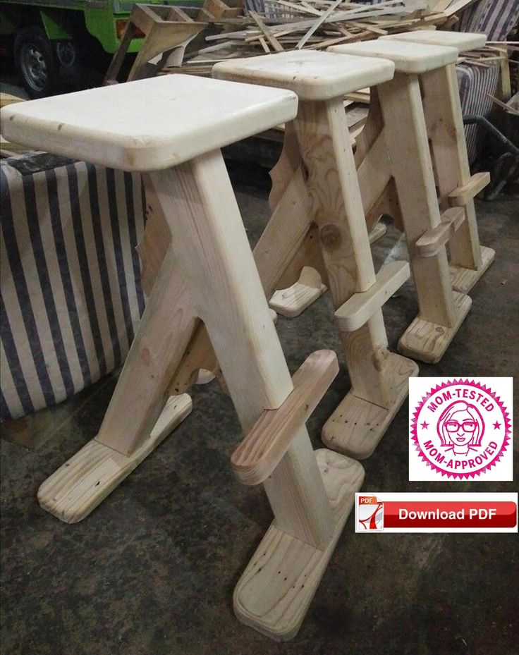 three wooden stools sitting next to each other