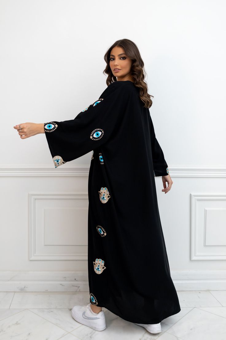 Featuring: Abaya Kimono Evil Eye & Hamsa Hand Embroidery Maxi Length Color: Black.Brand: Unmatched BYU Length: 55 inches. Black Long Kaftan With Intricate Embroidery, Traditional Floor-length Kimono For Eid, Traditional Floor-length Eid Kimono, Festive Black Long Sleeve Kimono, Traditional Black Festive Kimono, Traditional Black Dress With Kimono Sleeves, Embroidered Long Kimono For Eid, Embroidered Long Sleeve Kimono For Eid, Traditional Maxi-length Kimono For Eid