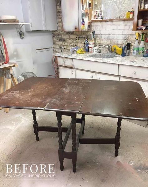 an old wooden table in the middle of a kitchen