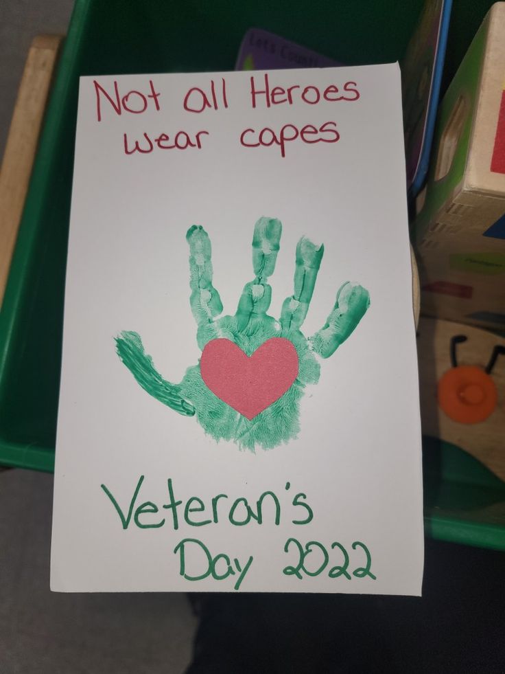 a handprinted sign that reads not all hero wears capes veteran's day 2092