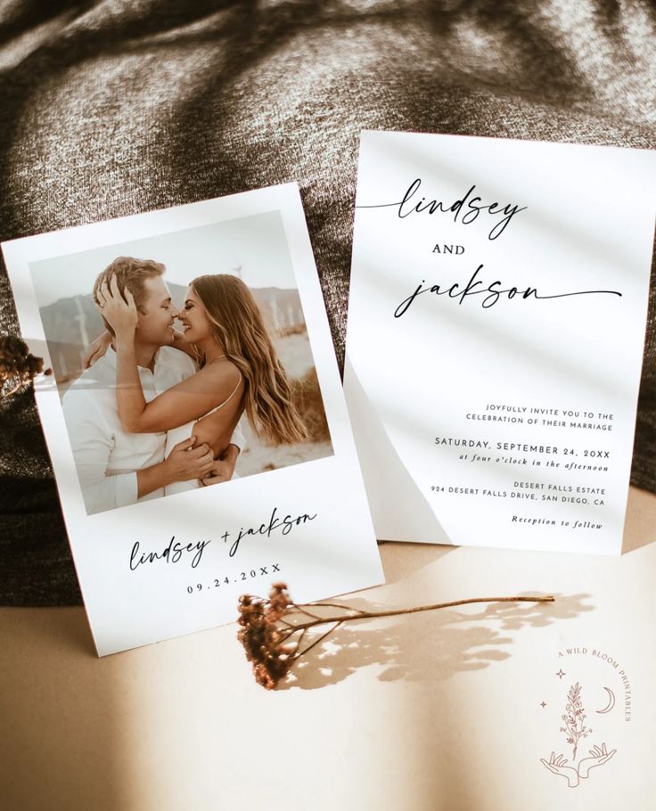 two wedding cards sitting on top of a bed next to each other with the same photo