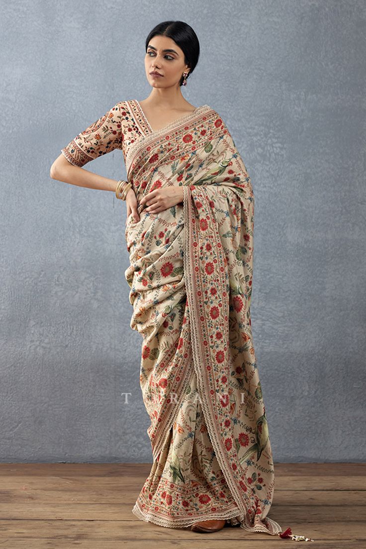 Beige saree with botanical digital print and tassel border. Paired with padded printed blouse.
Components: 2
Pattern: Printed
Type Of Work: Digital Print
Neckline: Scallop
Sleeve Type: Scallop
Fabric: Handwoven Chanderi, Cotton Silk
Color: Beige
Other Details: 
Botanic print
Back tassel tie-up
Scallop bordered blouse
Closure:
Blouse: Side zip
Occasion: Wedding,Bride - Aza Fashions Chintz Print, Mirror Work Saree, Saree Women, Chanderi Saree, Chintz Fabric, Saree For Women, Print Saree, Green Saree, Organza Fabric