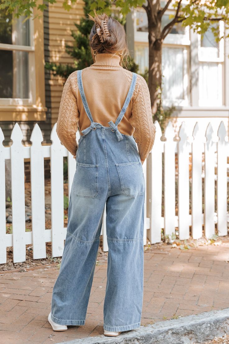 Elevate your boho style with the effortlessly cool Georgia Wide Leg Denim Overalls! Designed for those who love a retro vibe with a modern twist, these overalls are perfect for creating a relaxed yet chic look. The unique back knot detail enhances the overall design, giving these overalls a playful, bohemian finish. Pair with a fitted tee or a flowy blouse to create a carefree, boho-chic outfit that’s ready for anything! Medium Wash Overalls For Day Out, Chic Denim Overalls For Day Out, Spring Light Wash Overalls For Day Out, Chic Medium Wash Cotton Denim Jumpsuit, Chic Denim Blue Wide Leg Overalls, Chic Medium Wash Overalls For Spring, Denim Overalls For Day Out, Trendy Denim Overalls For Day Out, Chic High Waist Cotton Overalls