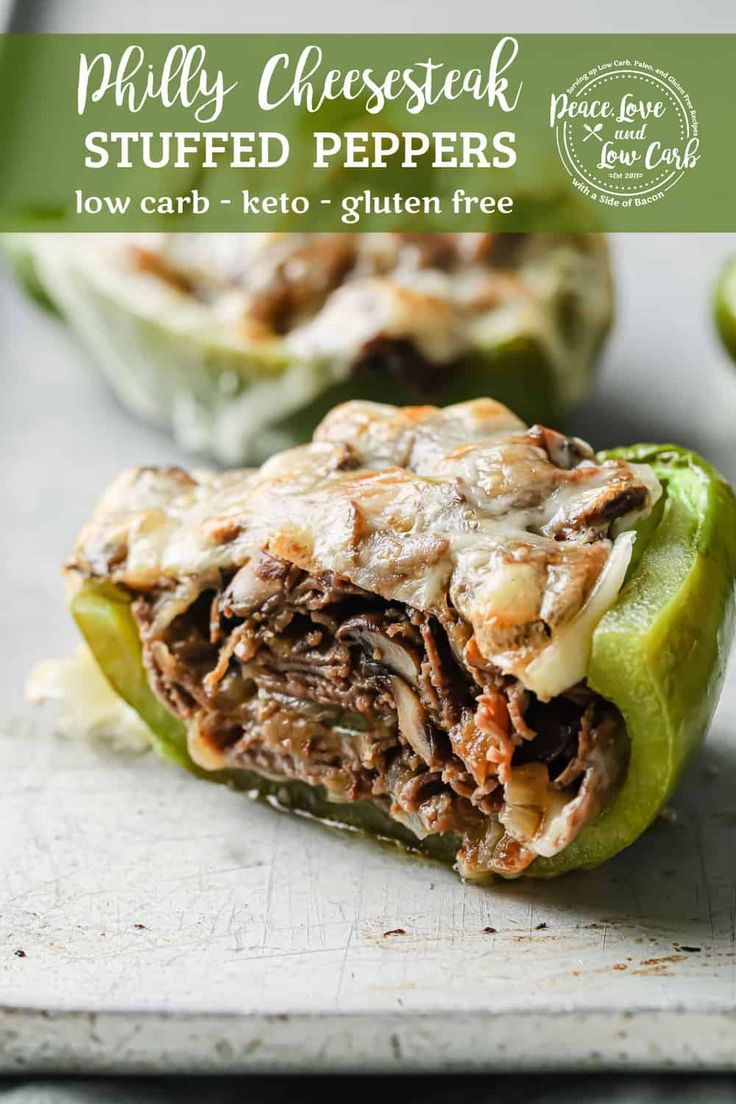 an image of stuffed peppers on a cutting board with text overlay that reads, phily cheese steak stuffed peppers low carb - keto - gluten free