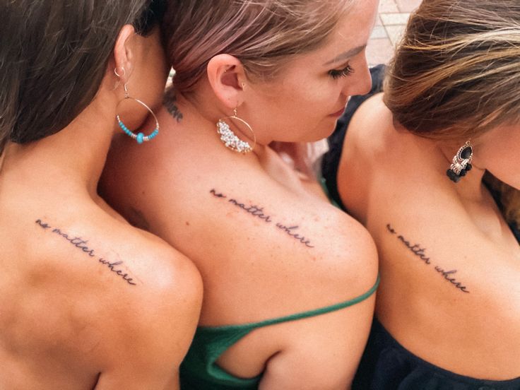 three beautiful women with tattoos on their backs