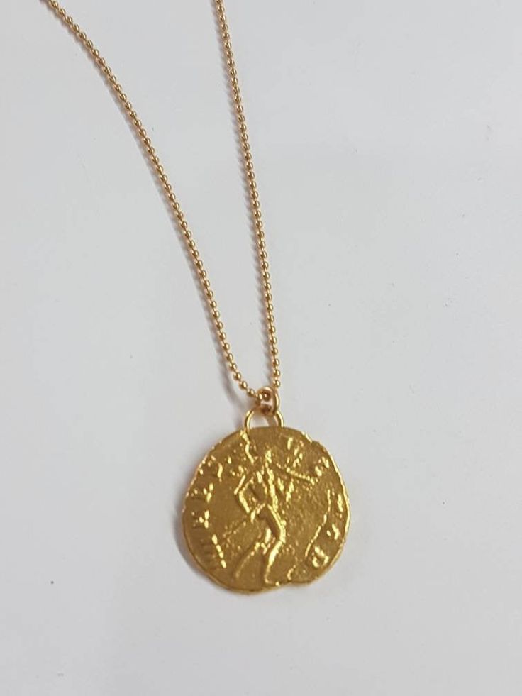 Coin pendant necklace, 14k gold necklace, antique coin necklace, gold coin necklace, gold delicate necklace, antique necklace, Roman coin This gold coin necklace was 100% handmade and has an antique Roman coin for a pendant. The necklace is 14k gold filled chain with a 14k gold plated coin pendant. It is also available in sterling silver (polished or oxidized as in the last photo). Dimensions: The 14k gold necklace is available in multiple lengths. The antique coin pendent's diameter is 1.5 cm ( Gold Medallion Amulet Coin Necklace, Yellow Gold Medallion Necklace With Coin Pendant, Gold Engraved Amulet-style Coin Necklace, Gold Engraved Coin Necklace In Amulet Style, Gold Engraved Coin Amulet Necklace, Gold Engraved Amulet Coin Necklace, Vintage Yellow Gold Coin Necklace, Tarnish Resistant, Gold Amulet Style Necklace With Coin Pendant, Gold Amulet Necklace With Coin Pendant