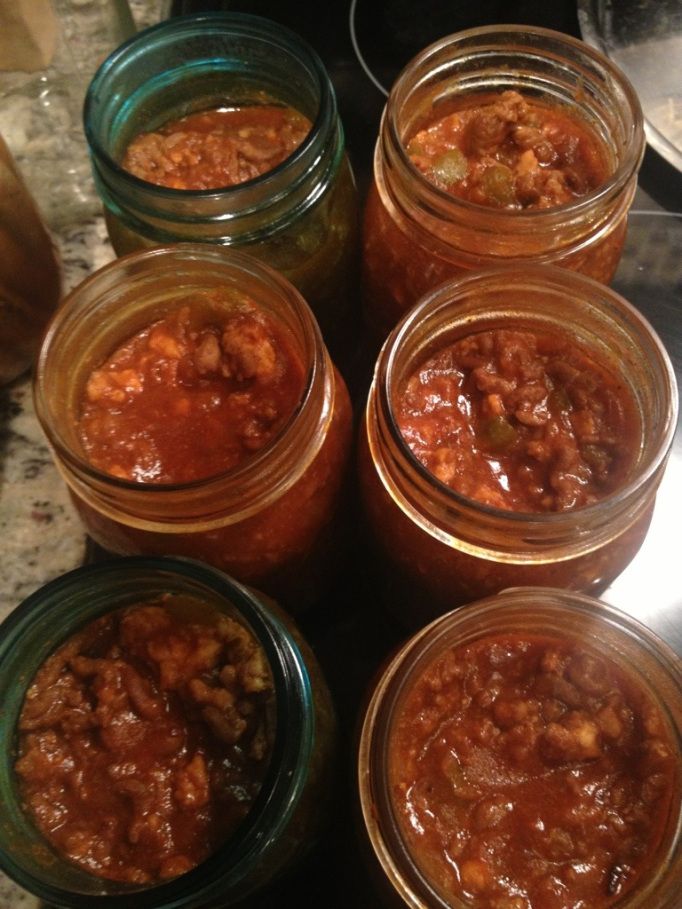 several jars filled with food sitting on top of a counter