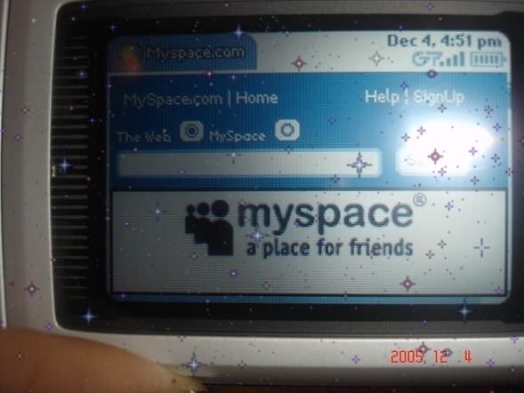 a close up of a cell phone screen with myspace on it's display window