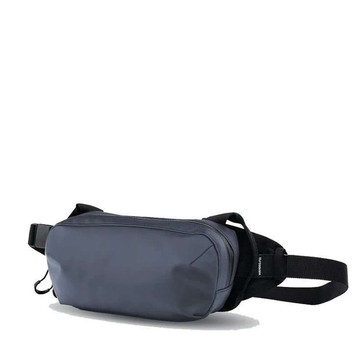 The WANDRD D1 Fanny Pack is a versatile bag that can be worn on your hip or cross-body style. With dedicated organization for things like your phone, keys, and wallet, and enough space to fit a small camera, this is one badass minimal carry solution. Features: Shoulder Carry Waist Carry Phone Pocket Fidlock Magnetic Buckle Dual Side Handles Small Camera Carry Cash/Passport Pocket Key Clip Weather Resistant YKK Zippers Internal Organization Specs: Dimensions: 5"H X 9"W X 2.5"D Volume: 2 L Weight: Modern Blue Belt Bag For Travel, Modern Portable Chest Bag For Everyday Use, Modern Blue Bag With Functional Pockets, Functional Blue Belt Bag For Travel, Modern Chest Bag With Cell Phone Pocket For On-the-go, Functional Chest Bag For Everyday, Everyday Belt Bag With Functional Pockets, Functional Camera Bag With Cell Phone Pocket For On-the-go, Modern Blue Belt Bag For Everyday Use