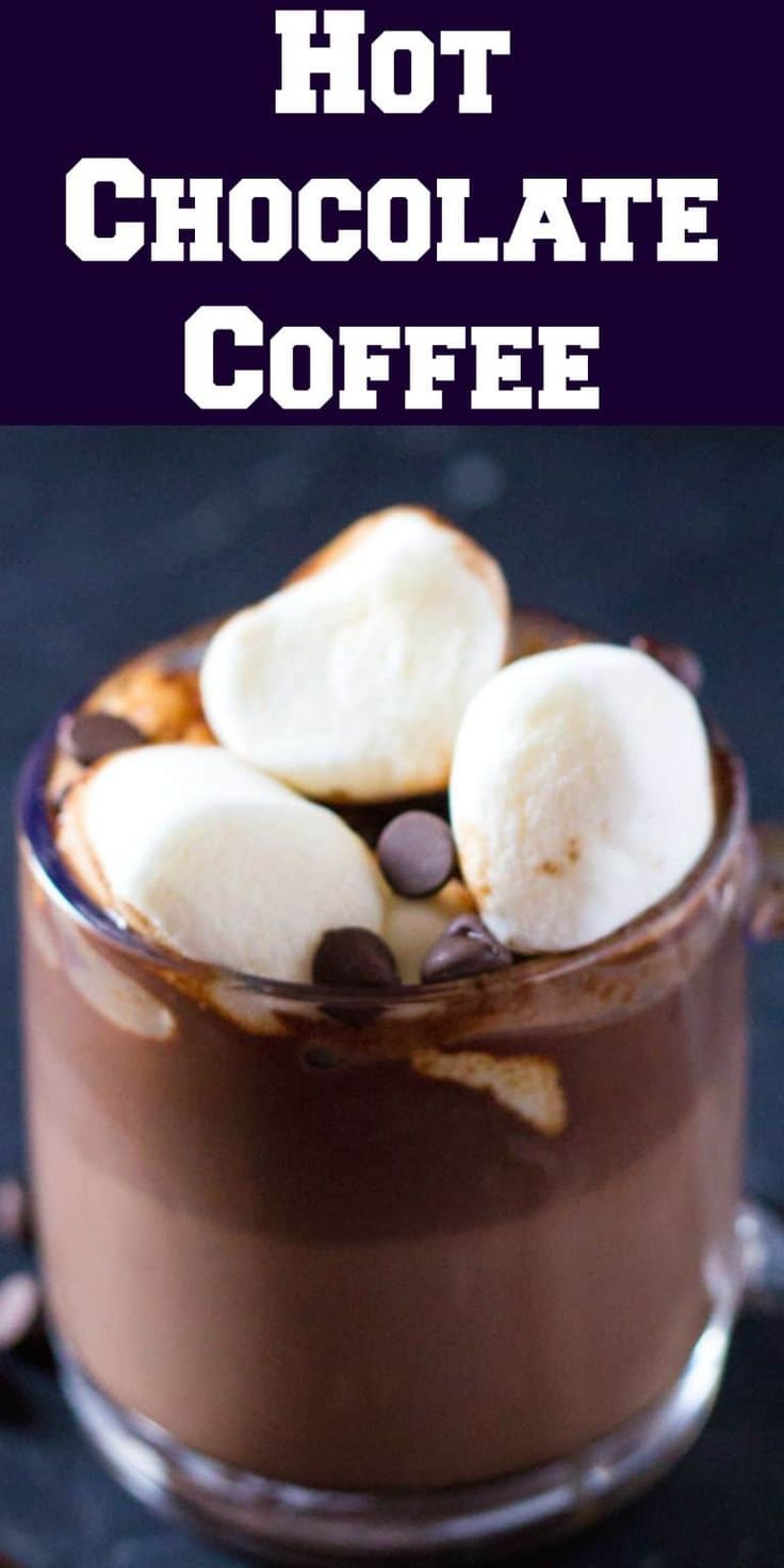 hot chocolate coffee in a glass mug with marshmallows and chocolate chips on top