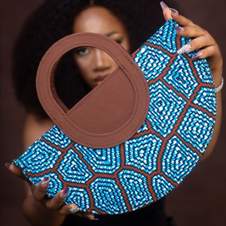 Brand Name: ModaBellaByFey First and Last Name: Feyisayo Agunbiade Short Bio: ModaBellaByFey is a Nigerian brand that prides itself in exploring the endless possibilities and versatility of African fabrics through our handmade bags, accessories and more. We are a youthful brand out to promote our love and passion for fashion, quality, and creativity. Email Address: info@modabellabyfey.com Mobile Number: 07732136753 Website: uk.modabellabyfey.com Full Instagram Handle: Modabellabyfey ... Arm Candies, Short Bio, Ankara Bags, Linen Bags, African American Fashion, Handmade Fabric Bags, African Wear Styles For Men, African Bag, Creative Bag