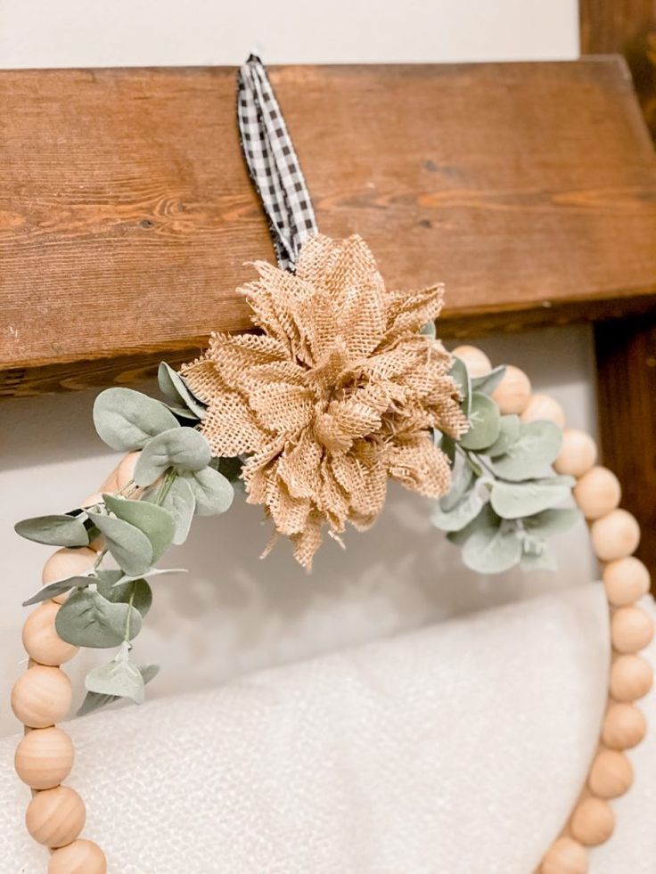 a wooden beaded necklace with a flower on it