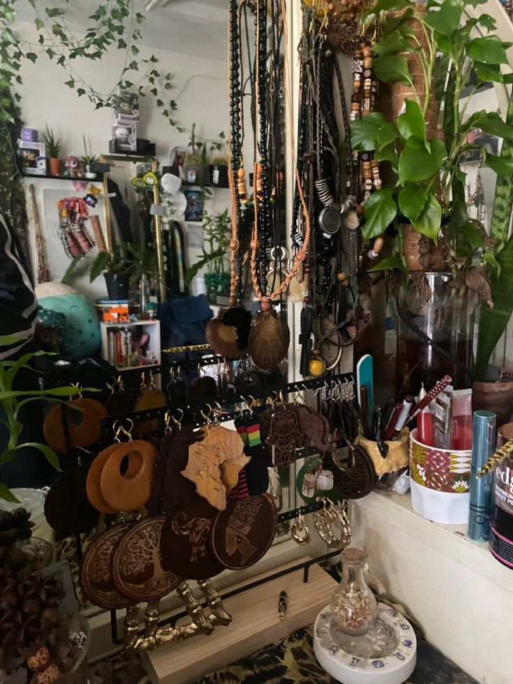 there are many necklaces on display in this room, and one is hanging from the ceiling