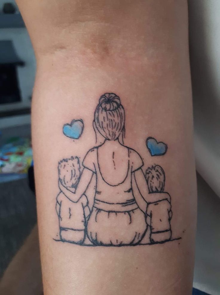 a woman and two children tattoo on the arm