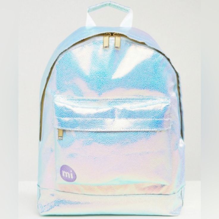 Brand New Mipac Pebbled Iridescent Backpack. Had This In The Top Shelf Of My Closet Since I Bought It And It’s Never Been Used, Though It May Have Very Slight Signs Of Age Due To Sitting In My Closet. This Bag Has An Exterior Zippered Pocket And An Interior Sleeve Pocket Ideal For Storing Laptops Or Small Electronics. Https://Www.Refinery29.Com/En-Us/Shop/Product/Pebbled-Iridescent-Backpack-99663 Iridescent Bag With Zipper Closure For Everyday Use, Everyday Iridescent Bag With Zipper Closure, Iridescent Bags With Zipper Closure For Everyday Use, Iridescent Everyday Bags With Zipper Closure, Iridescent Backpack For Everyday Use, Iridescent Standard Backpack For Everyday Use, Top Shelf, Travel Bags, Womens Sizes