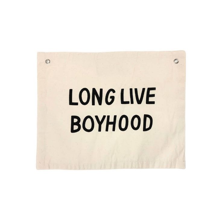 a sign that says long live boyhood hanging from the side of a white wall