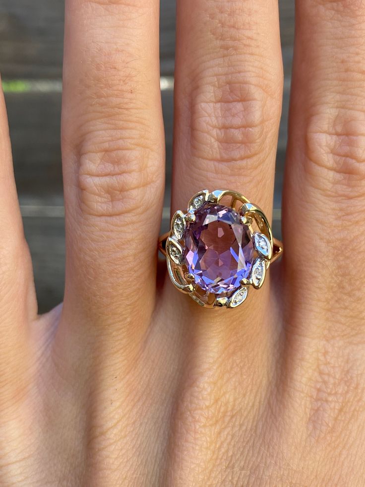 Total Weight: 5.2 grams Size: 6.75 Width: 1.8-4.4mm Amethyst: 12.3x9.7mm Diamonds: Under 1mm, very small Condition: In great condition showing little wear with no damage. All gold has been thoroughly checked with an Olympus XRF spectrometer. It is guaranteed 14k gold.  All our jewelry is properly washed and disinfected to ensure customers get clean items with every order.  Returns accepted but may be subjected to a restock fee.  Please message with any questions:) Elegant Lavender Amethyst Ring In 14k Gold, Formal Lavender Amethyst Ring With Oval Shape, Formal Lavender Oval Amethyst Ring, Oval Amethyst Ring Stamped 14k, Formal Lavender Oval Ring, Formal 14k Stamped Amethyst Ring, Lavender Amethyst Ring For Formal Occasions, Lavender 14k Gold Jewelry For Formal Occasions, Formal Purple Birthstone Gemstones