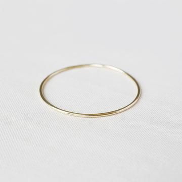 The classic Yearly Co. 14k bangle in a heavier weight and slightly thicker width. This bangle is made of solid 14k gold and measures 1.6mm thick or 14 gauge. Available in yellow, white and rose gold. Simple 14k Yellow Gold Bracelets, Everyday Timeless Stackable Bangle, Minimalist Stackable Round Band Bracelets, Minimalist Stackable Bracelets With Round Band, Delicate Gold Jewelry With Smooth Bezel, Minimalist Yellow Gold Bracelets For Layering, Timeless Stackable Round Bangle, Minimalist 14k Gold-filled Round Bracelets, 14k Rose Gold Bangle