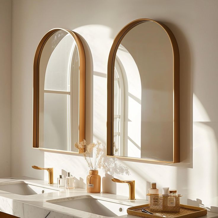 a bathroom with two sinks, mirrors and soap dispensers on the counter