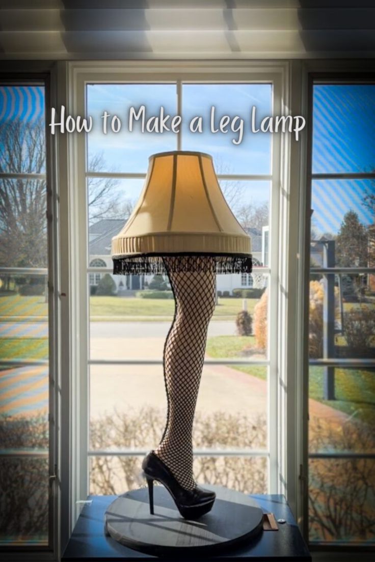 a lamp sitting on top of a table next to a window with the words how to make a leg lamp