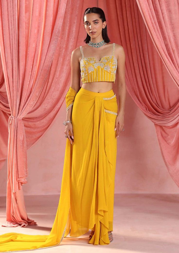 Seema Thukral-Nina Mustard Yellow Draped Skirt And Blouse-INDIASPOPUP.COM Bollywood Style Draped Evening Dresses, Bollywood Draped Evening Dress, Draped Georgette Dresses For Diwali, Elegant Draped Dress With Dupatta, Navratri Draped Sets With Sheer Dupatta, Bollywood Silk Draped Dress, Bollywood Style Draped Silk Dress, Draped Georgette Dress With Zari Work, Draped Dress With Zari Work For Reception