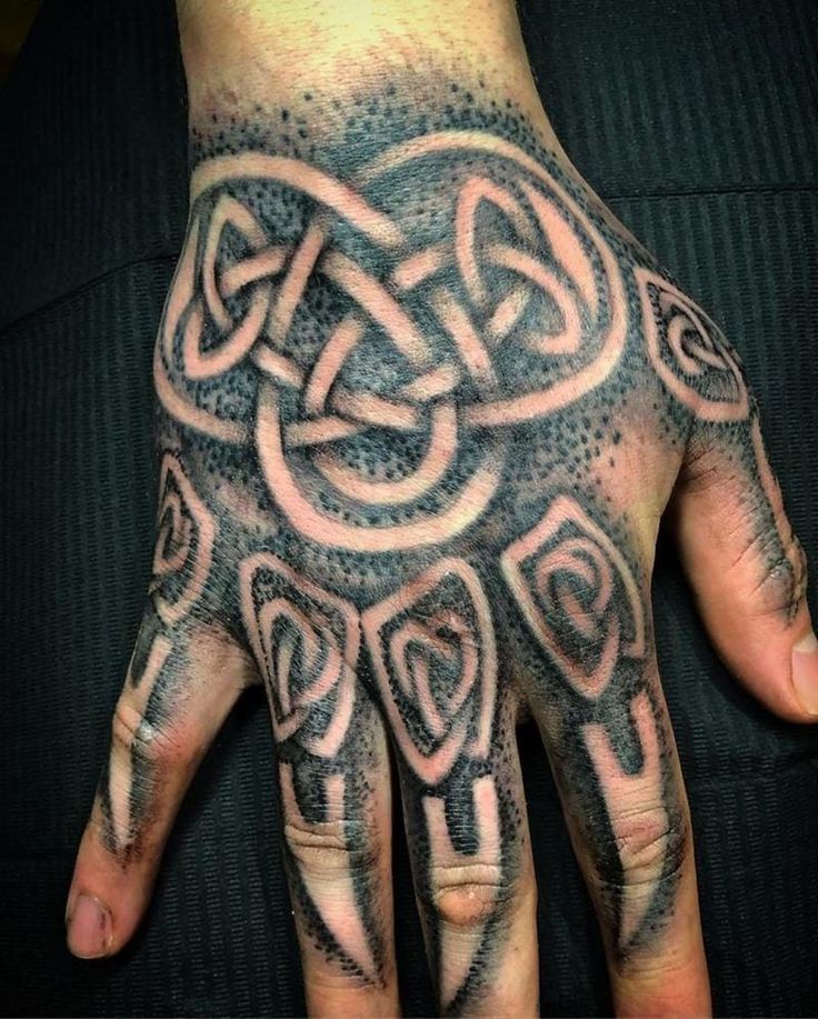 a hand with an intricate design on it