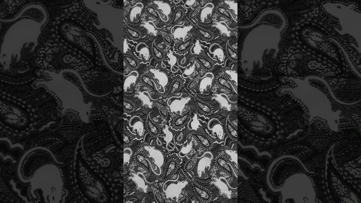 an abstract black and white pattern with skulls in the center, on a dark background