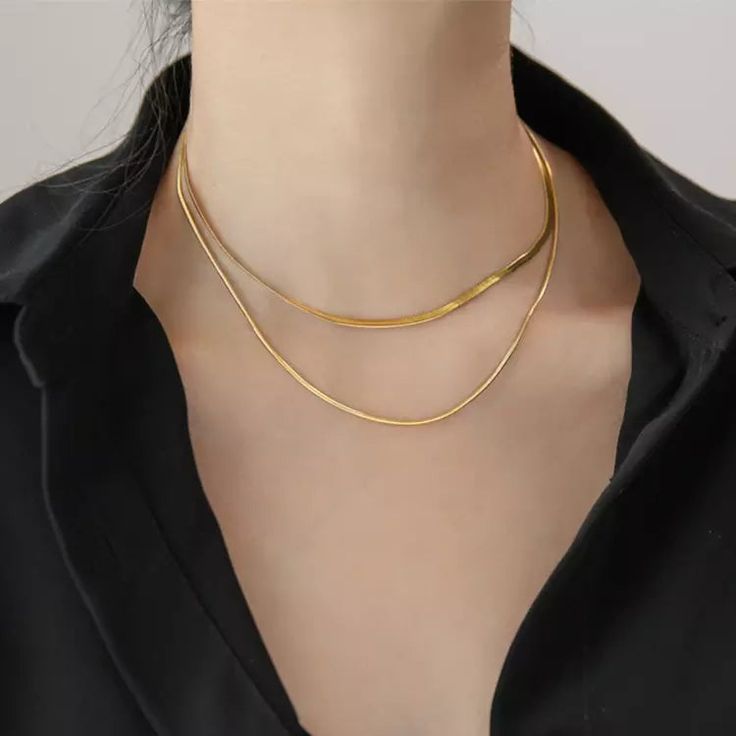 Obsessed with vintage jewelry? Look no further! Our 18K gold plated metal chain necklace adds a unique, stylish touch with its double layers of flat snake bone chains. Get the classic look with a modern twist! Elegant Gold-tone Snake Chain Necklace, Double Snake Chain Necklace, Chic Gold Snake Chain Necklace, Elegant Double Chain Herringbone Necklace As Gift, Elegant Herringbone Necklace With Double Chain Gift, Trendy Gold Snake Shape Chain Necklace, Trendy Gold Snake-shaped Chain Necklace, Elegant Gold Metal Snake Chain Necklace, Layering Snake Chain Necklace