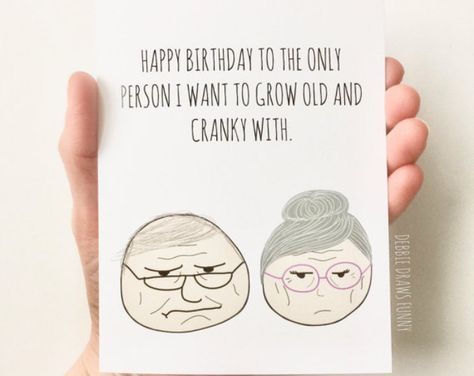 a person holding up a card with an image of two older people on it that says happy birthday to the only person i want to grow old and cranky with